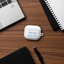 Rise & GRIND Case for AirPods on a desk with laptop and notebook, showcasing stylish protection.