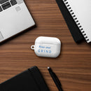 Rise & GRIND Case for AirPods on a desk with laptop and notebook, showcasing stylish protection.